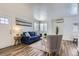Bright living room showcases wood floors, neutral decor, and a cozy seating arrangement at 2060 W Iliff Ave, Englewood, CO 80110