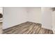 Empty room features hardwood floors and fresh, white painted walls at 2060 W Iliff Ave, Englewood, CO 80110