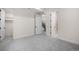 Bright bedroom with plush carpet and access to stairwell and modern bathroom at 1601 S Columbine St, Denver, CO 80210