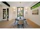 Elegant dining room with natural light, modern chandelier, and stylish decor at 1601 S Columbine St, Denver, CO 80210