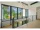 Bright foyer with an open staircase featuring steel railings and large windows with neighborhood views at 1601 S Columbine St, Denver, CO 80210