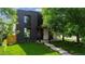 Contemporary home featuring dark brick, modern windows, and a well-manicured lawn at 1601 S Columbine St, Denver, CO 80210