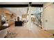Spacious open-concept kitchen featuring an island, stainless steel appliances, and modern lighting at 1601 S Columbine St, Denver, CO 80210