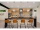 Modern kitchen with stainless steel appliances, custom cabinets, and a large center island with barstool seating at 1601 S Columbine St, Denver, CO 80210