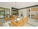 Open-concept living area with modern furnishings, hardwood floors, and seamless access to the kitchen at 1601 S Columbine St, Denver, CO 80210