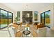 Bright and airy living room featuring hardwood floors, a fireplace, and large sliding glass doors at 1601 S Columbine St, Denver, CO 80210