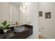 Stylish powder room featuring a unique vessel sink, modern lighting, and sophisticated decor at 1601 S Columbine St, Denver, CO 80210