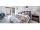 Cozy bedroom featuring a sliding glass door to the backyard, soft textiles, and modern decor at 16086 E Ithaca Pl # D, Aurora, CO 80013