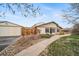 Charming home with a well-maintained exterior, walkway, and landscaping at 16086 E Ithaca Pl # D, Aurora, CO 80013