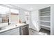 The light-filled kitchen features a window, stainless steel appliances, and direct access to the backyard at 16086 E Ithaca Pl # D, Aurora, CO 80013