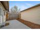 Concrete patio features wood chips and a wood fence at 16086 E Ithaca Pl # D, Aurora, CO 80013