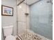 Modern bathroom with glass shower door, stylish tile, and sleek fixtures at 4505 S Yosemite St # 102, Denver, CO 80237