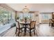 Elegant dining room with a large round table, stylish chairs, and natural light at 4505 S Yosemite St # 102, Denver, CO 80237