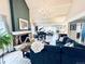 Bright and airy living room with a fireplace, vaulted ceilings, and a grand piano at 4505 S Yosemite St # 102, Denver, CO 80237