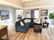 Cozy living room with comfortable seating, modern decor, and hardwood floors at 4505 S Yosemite St # 102, Denver, CO 80237