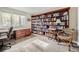 Home office with built-in bookcase and desk at 4505 S Yosemite St # 102, Denver, CO 80237