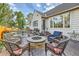 Relaxing backyard patio featuring a fire pit with outdoor seating, ideal for entertaining guests at 4505 S Yosemite St # 102, Denver, CO 80237