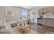 Bright living room featuring modern finishes, a dining area with city views, and stylish furniture at 2374 S University Blvd # 503, Denver, CO 80210