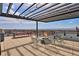 Inviting rooftop deck with fire pit, comfortable seating, and panoramic views at 2374 S University Blvd # 503, Denver, CO 80210