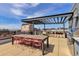 Spacious rooftop deck with outdoor dining, grilling area, and city views at 2374 S University Blvd # 503, Denver, CO 80210
