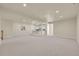 Expansive basement featuring plush carpeting, recessed lighting, and stylish bar at 7572 Kelty Trl, Franktown, CO 80116