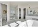 Elegant bathroom featuring a glass-enclosed shower, dual vanity, and stylish finishes at 7572 Kelty Trl, Franktown, CO 80116