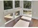 Bright and airy sunroom featuring large windows and hardwood flooring at 7572 Kelty Trl, Franktown, CO 80116