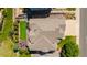 Aerial view of a home featuring a deck and patio furniture, manicured lawn, and landscaping at 6787 Serena Ave, Castle Pines, CO 80108