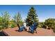 Inviting deck with blue Adirondack chairs, creating a cozy outdoor living space at 6787 Serena Ave, Castle Pines, CO 80108