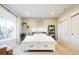 Inviting bedroom with a comfy bed, ample natural light, and neutral tones, creating a peaceful retreat at 6787 Serena Ave, Castle Pines, CO 80108