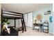 Unique bedroom with a lofted bed, desk, and playful decor at 6787 Serena Ave, Castle Pines, CO 80108