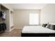 A serene bedroom features a closet and large window at 6787 Serena Ave, Castle Pines, CO 80108