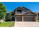 Charming two-story home featuring a three-car garage, stone accents and a private balcony, perfect for enjoying the outdoors at 6787 Serena Ave, Castle Pines, CO 80108