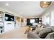 Spacious living room featuring built-in shelving, plush seating, and modern decor at 6787 Serena Ave, Castle Pines, CO 80108