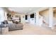 Bright open living area with stairs and modern decor, perfect for entertaining at 6787 Serena Ave, Castle Pines, CO 80108