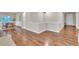 Living room with hardwood floors and views into a dining area at 9754 W Ontario Pl, Littleton, CO 80128