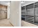 Spacious walk-in closet with custom shelving, drawers, and ample storage space at 9754 W Ontario Pl, Littleton, CO 80128