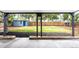 A covered patio overlooks a big backyard with a shed and a wooden fence at 3065 S Eudora St, Denver, CO 80222
