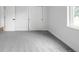 Clean bedroom with neutral carpet, natural light, and white closet doors at 3065 S Eudora St, Denver, CO 80222