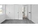 Bright bedroom with plush carpet, white walls, and access to additional rooms at 3065 S Eudora St, Denver, CO 80222