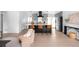 Open layout featuring a stylish gray kitchen with counter seating and stainless steel appliances at 3065 S Eudora St, Denver, CO 80222