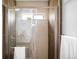 Luxurious shower with glass enclosure, sleek hardware, and neutral-toned tile surround at 3065 S Eudora St, Denver, CO 80222