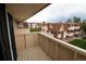 Apartment balcony overlooking manicured green space and residential buildings at 10211 Ura Ln # 9-308, Thornton, CO 80260