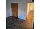 Comfortable bedroom featuring a spacious closet with wood-look floors and natural light at 10211 Ura Ln # 9-308, Thornton, CO 80260