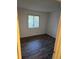 Well lit bedroom featuring laminate floors and a window providing natural light at 10211 Ura Ln # 9-308, Thornton, CO 80260