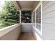 View from the covered balcony showing the mature evergreen tree at 19240 E Carolina Dr # 104, Aurora, CO 80017