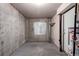 Unfinished basement with concrete walls, a small window, and utility hookups. Good storage space at 19240 E Carolina Dr # 104, Aurora, CO 80017