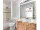 Bathroom featuring a shower, toilet, vanity, and neutral design at 19240 E Carolina Dr # 104, Aurora, CO 80017