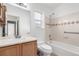 Bright bathroom featuring a shower over the tub, updated vanity, and natural light at 19240 E Carolina Dr # 104, Aurora, CO 80017