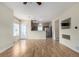 Open-concept living area with hardwood floors connecting to the kitchen and dining spaces at 19240 E Carolina Dr # 104, Aurora, CO 80017